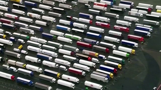 Trucks park on motorways and Manston airfield in Kent as French Covid shutdown causes huge tailbacks