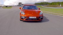 The new Porsche Panamera Turbo S in Papaya Metallic Track Driving