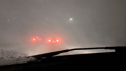 Traffic slows to a crawl amidst blizzard conditions