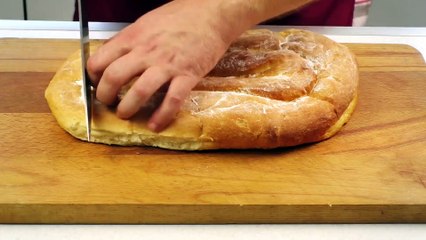 Slicing fresh bread_تقطيع خبز طازج