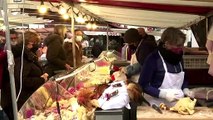 Parisians hit Xmas Eve markets despite COVID woes