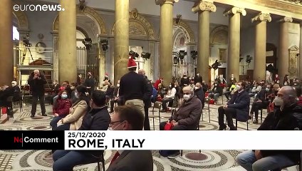 Italian volunteers handout Christmas lunch boxes to the poor