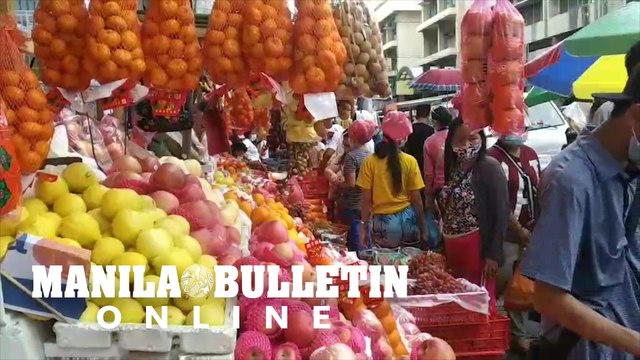 Residents in Davao City buying round fruits ahead of the New Year's eve celebration