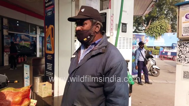 Two-wheelers drive in for filling fuel at HP petrol pump during Coronavirus Pandemic