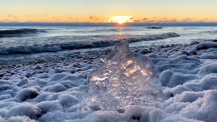 Sunrise over icy Lake Michigan