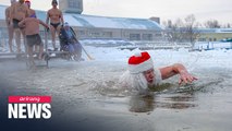 Freezing cold does not stop Siberians from swimming in iced river