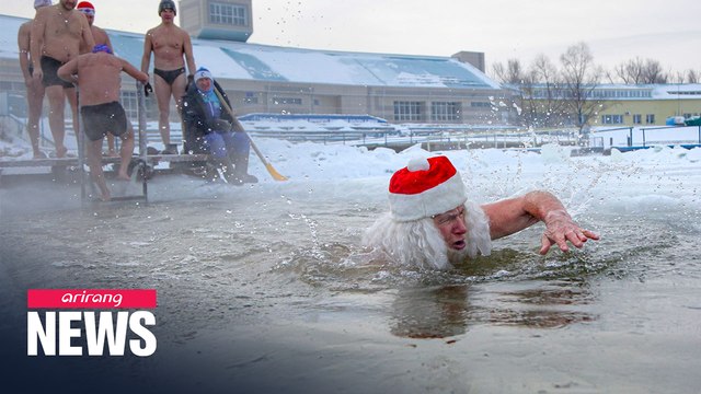 Freezing cold does not stop Siberians from swimming in iced river