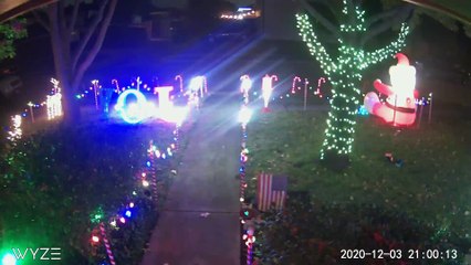 Car Drives Through Christmas Display