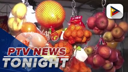 74-year-old woman braves crowded Divisoria to buy round fruits for 'Media Noche'