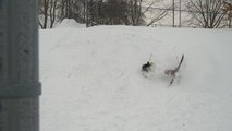 Skier Crashes Hard Into Snow While Launching Off Of Snow Ramp