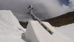 Guy Jumps Off Snow Ramp And Skis Backwards On Adjacent Ramp