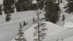 Guy Jumps Backward Off Snow-ramp towards Snow-Slope While Skiing