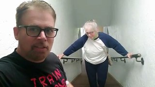 Man encourages elderly mother climbing the stairs in hilarious way