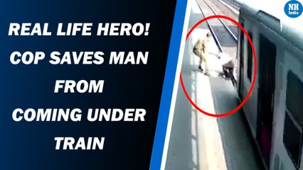 Real Life Hero! Cop Saves Man From Coming Under Train