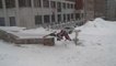 Skier Crashes to the Ground While Grinding Down Concrete Handrail