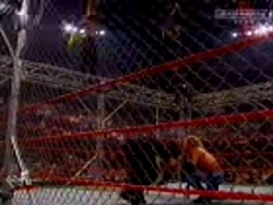 Jeff Hardy does a Dragon Attack off the cage