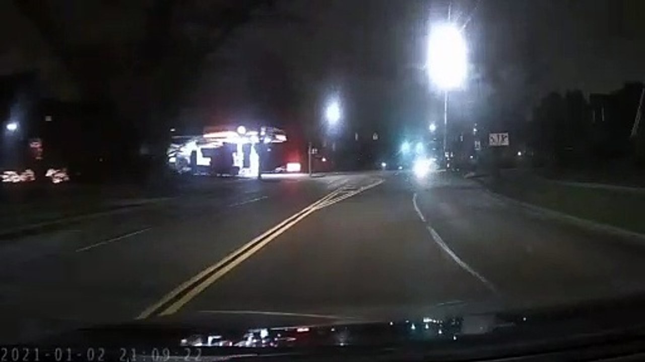 Crazy driver blows through red light