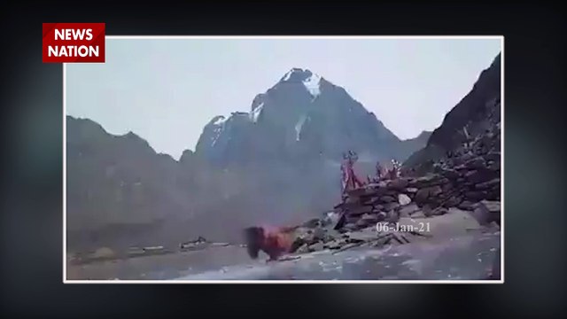 Holy man digs through ice to take bath in Himalayan mountains