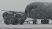 Iowa National Guard helps move plane against snowy conditions