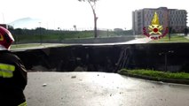 Huge sinkhole in parking lot swallows cars