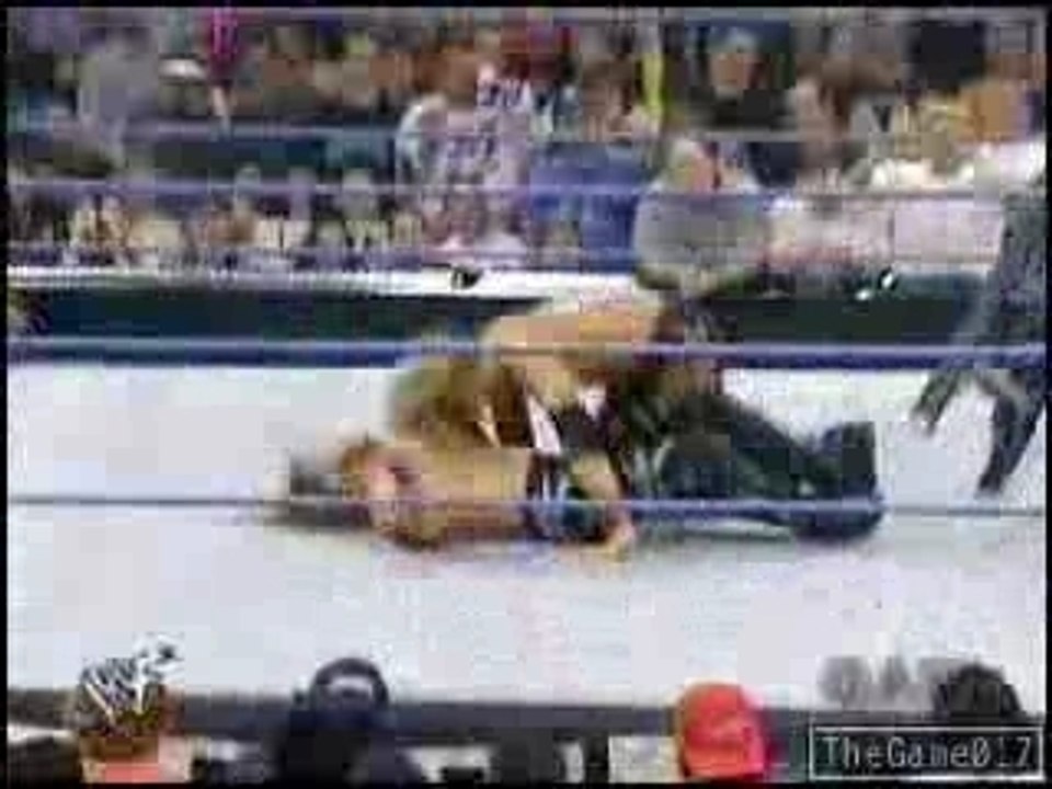 Edge spears Chris Jericho from a ladder