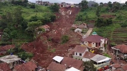 Back-to-back landslides kill at least 11 in an Indonesian village
