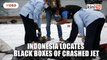 Indonesia locates black boxes of crashed jet as body parts recovered