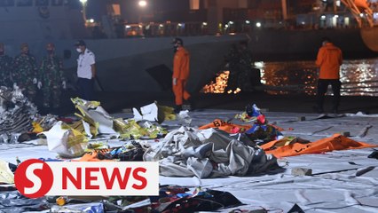 Indonesia steps up search for plane crash victims, 'black box'