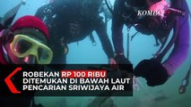 Robekan Uang Rp 100 Ribu dan Baju Pramugari Ditemukan di Bawah Laut Pencarian Sriwijaya Air