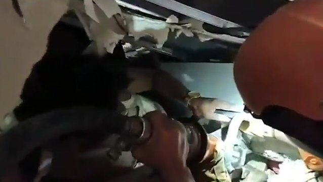 Rescuers search through rubble to find survivors after deadly Indonesian earthquake