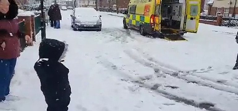 Firefighters take part in snowball fight with child in Sheffield suburb
