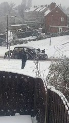 Rotherham residents rescue hearse as it struggles up hill in snow
