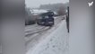 Double decker bus slides sideways down icy hill