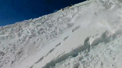 Snowboarder captures ride down avalanche on video