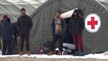 Bosnia moves migrants into army tents after criticism