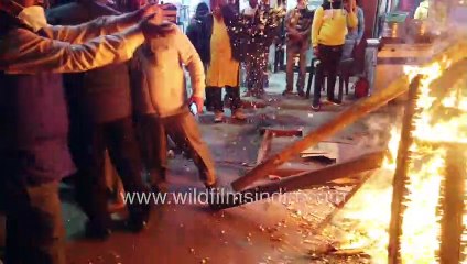 Lohri celebration during Covid Pandemic - Community bonfire with devotees offering sweets