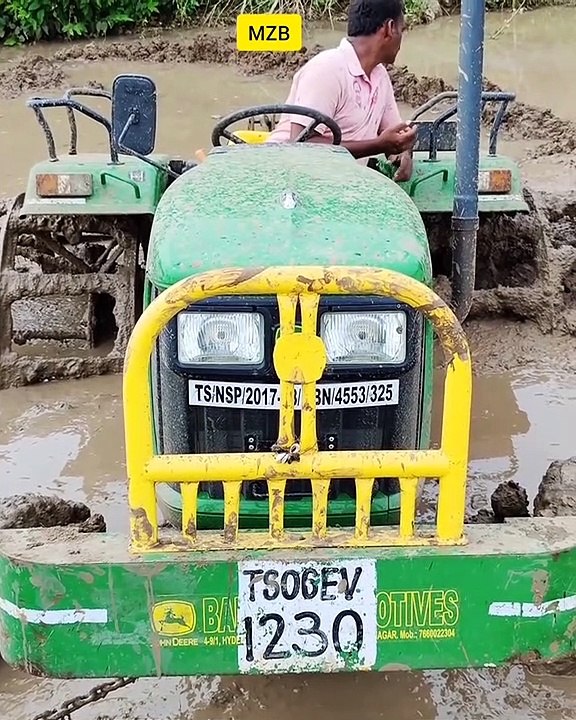 John Deere 5045D tractor stuck in mud Rescued by new holland tractor and TATA Hitachi