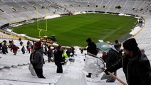 Clearing snow from NFL stadiums requires many hands