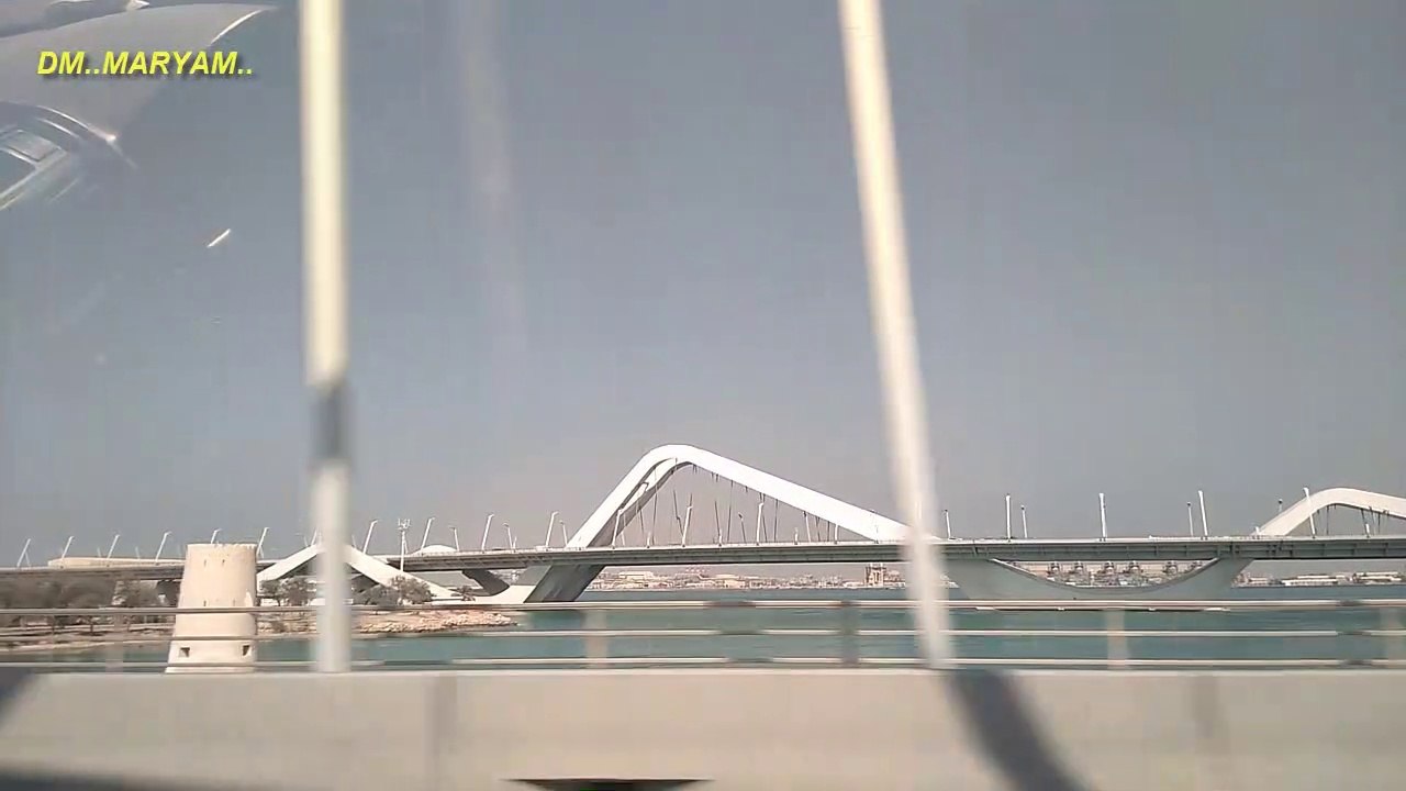 Road board signs on the way to Dubai and Abu Dhabi | Aerial view of transport on Sheikh Zayed Road, Dubai, UAE