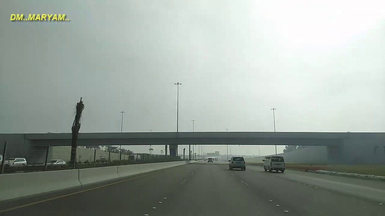 Dubai desert road | Dubai skyline at sunset with beautiful city center lights and Sheikh Zayed road traffic, Dubai, United Arab Emirates