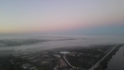 Parts of South Florida peek over thick fog