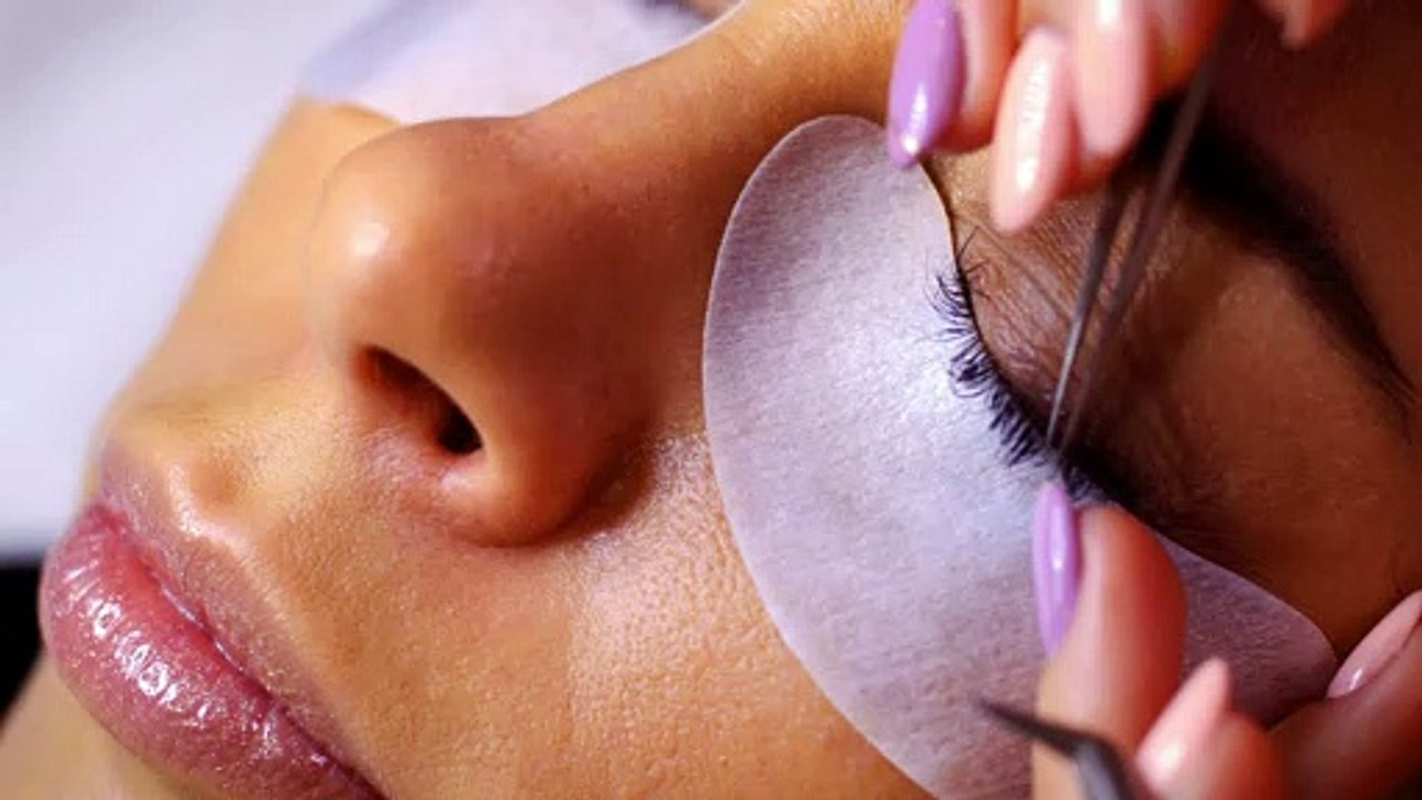 Lady Getting Her Eyelashes Done by a Professional Beautician