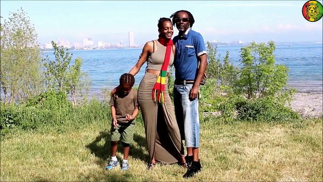 RAS-TAFARI STANDING WITH THE GOLDEN LAMB (JAH)