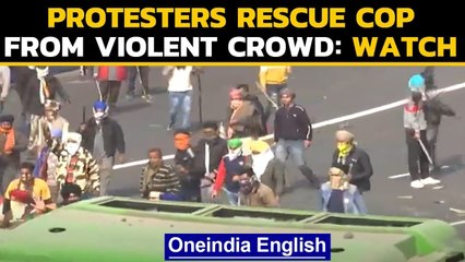 Tractor Rally: Video shows protesters rescuing the cop from a violent mob: Watch |Oneindia News