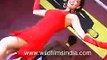 Sandip Soparrkar with female dancer in backless red dress Latin dancing