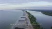 Pithrody Udyavar Beach in aerial view _ Beach between sea and river in Udupi, Karnataka