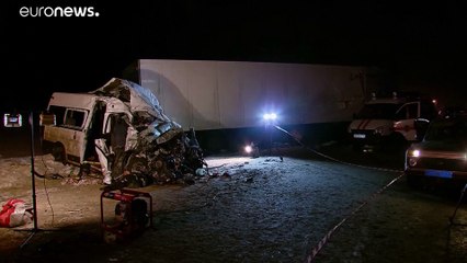 At least a dozen die after a tractor collides with a bus in central Russia