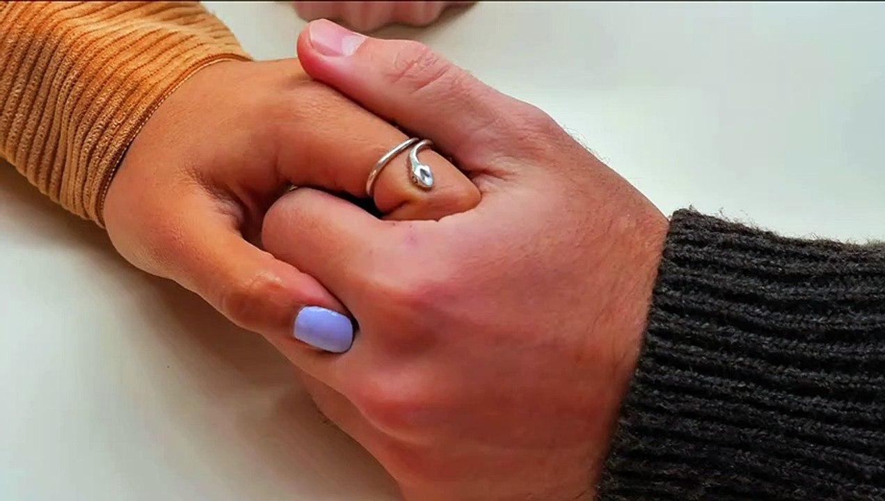 Boy Holding His Girlfriend's Hand with Love