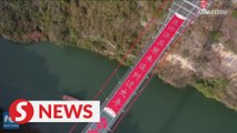 168m-long New Year scroll on world's longest glass-bottomed bridge