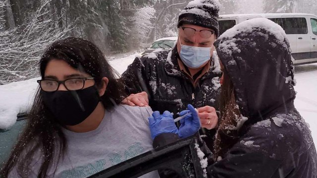 Health Care Workers Give Out Highway Vaccinations After Getting Stuck In Storm
